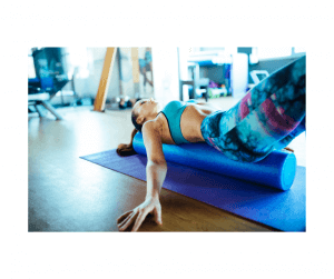 Woman using a foam roller for spinal mobility